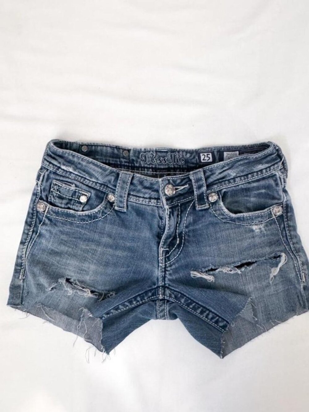 Y2k miss me micro denim shorts with distressed rips with a mid rise